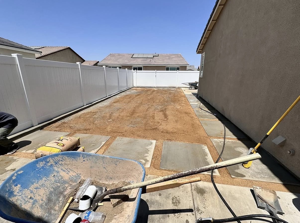 Side yard prepped with compacted base before turf installation